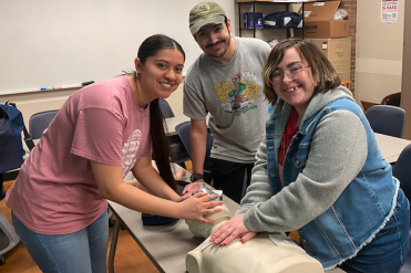 psi beta students with cpr dummy