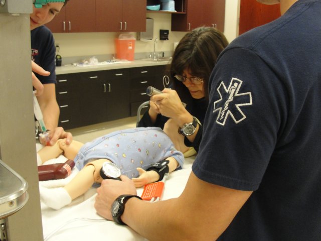 EMS Students checking blood pressure on simulator