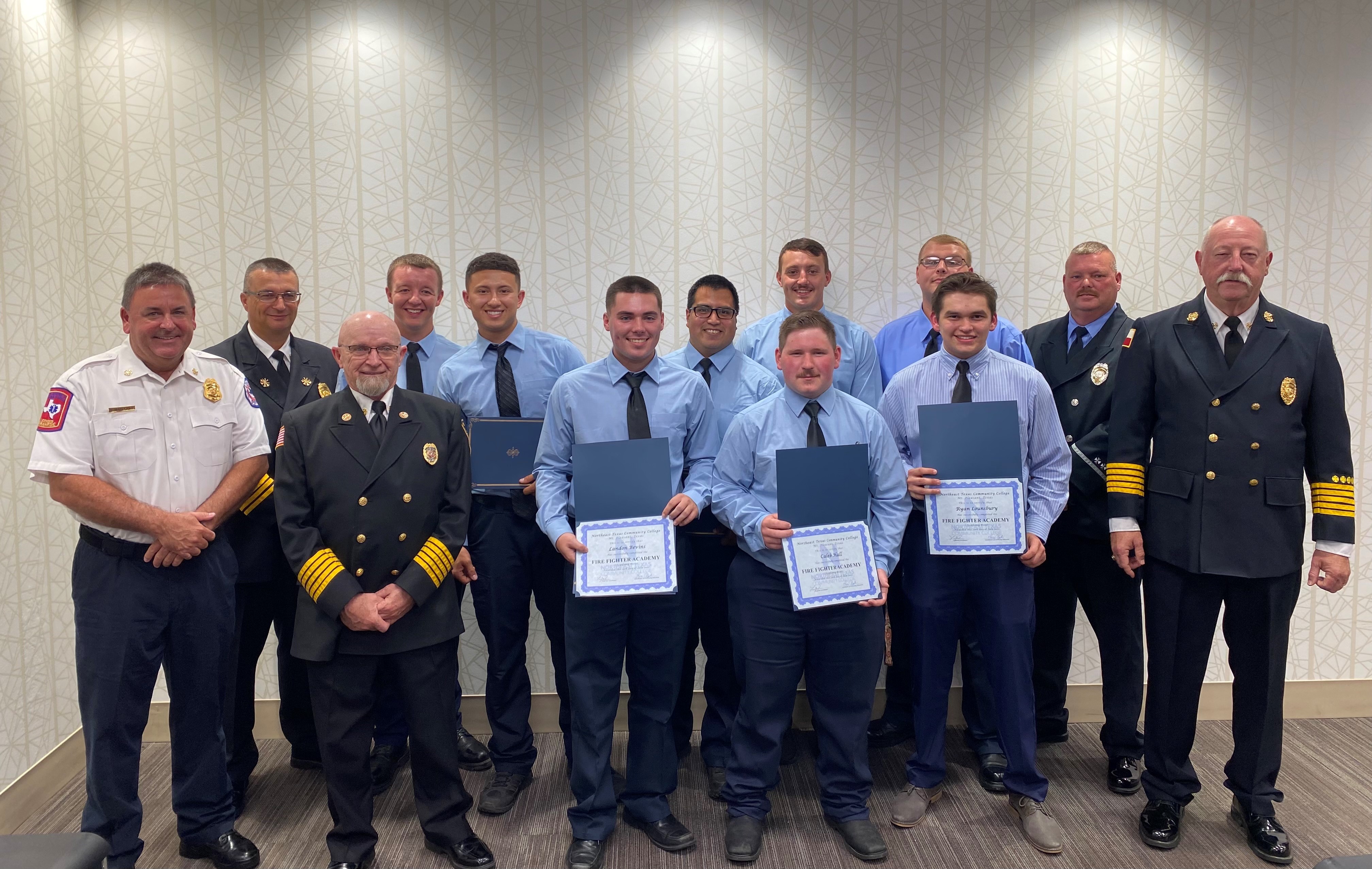 firefighter graduates with instructors