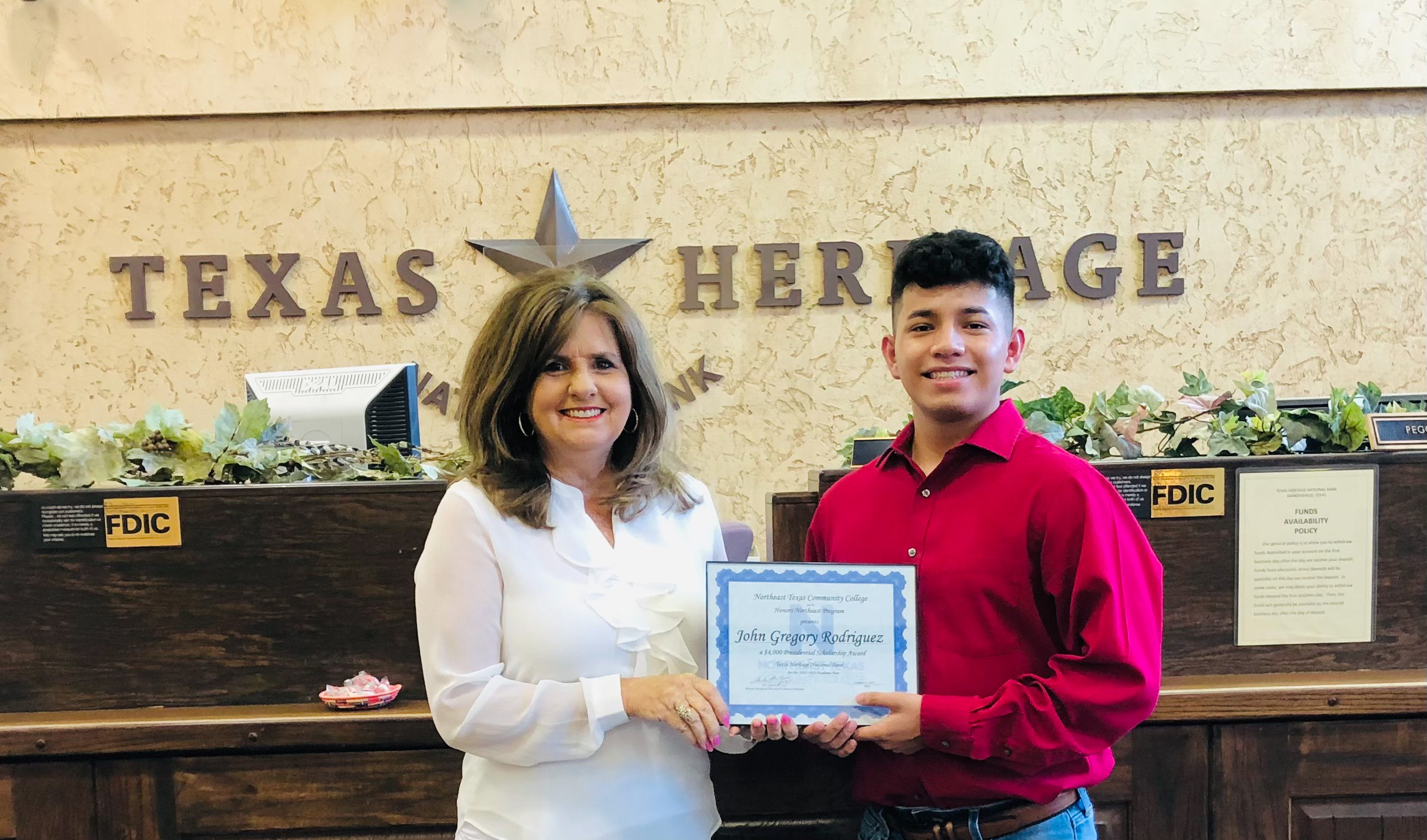 Vice President presents John with award. 