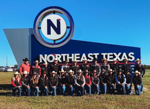 rodeo team group photo in front of NTCC sign.
