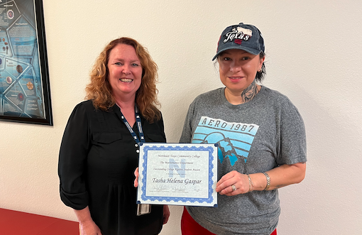 Johnston present Gaspar with award.