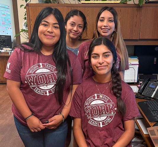 Work4college girls in matching shirts.