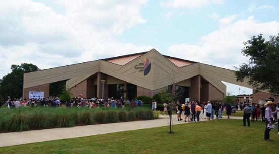 people outside after graduation event