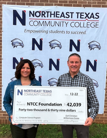 may and McCullough with large check for donation.