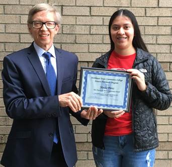Perez receiving certificate