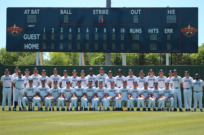 baseball team in front of new scoreboard