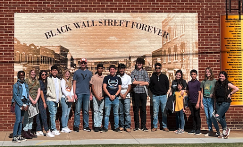 group in front of mural in Tulsa
