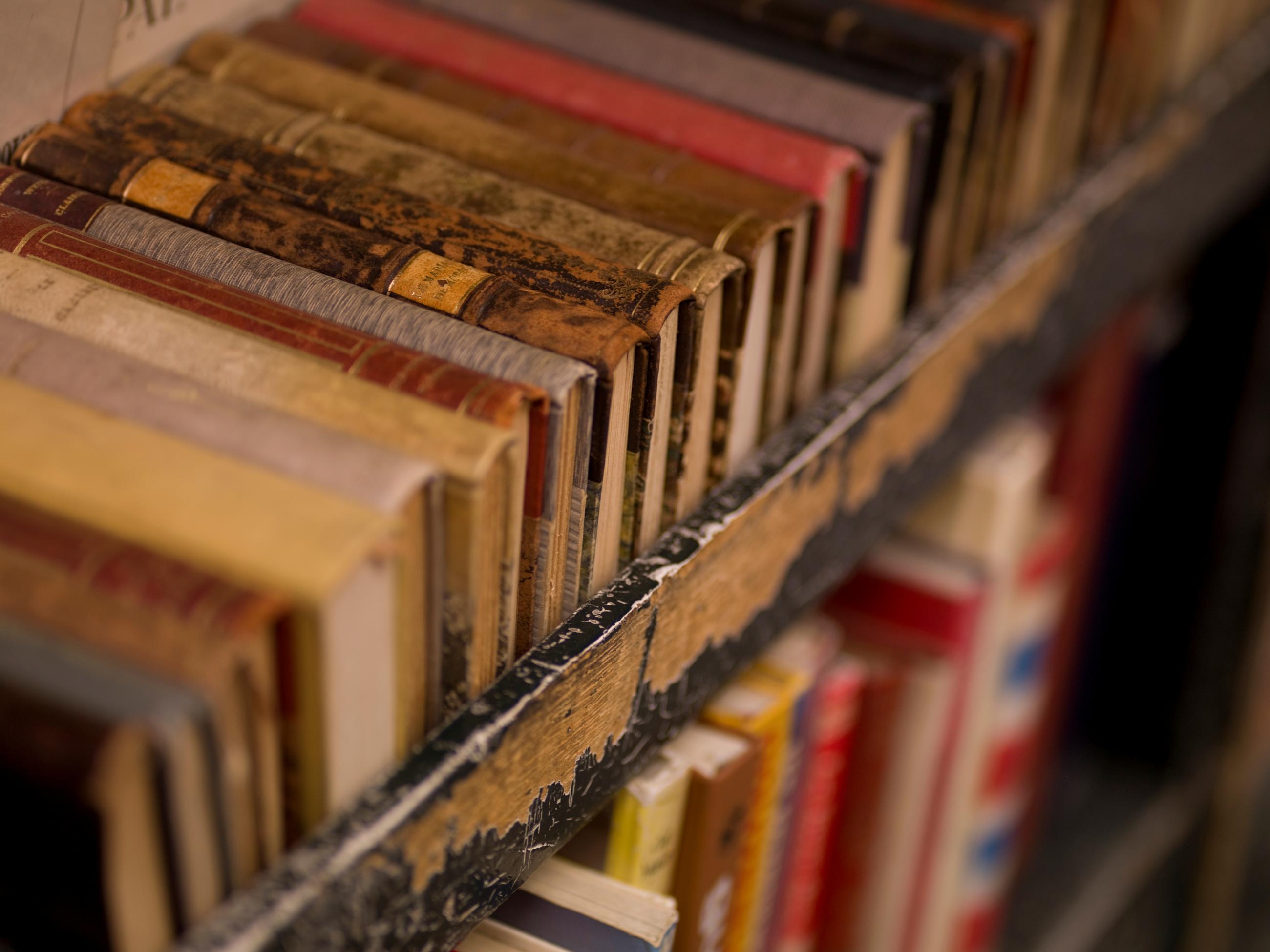 Library books on a book cart.