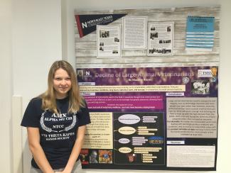 Risner pictured with her poster