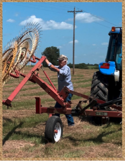 2nd place image of farmer working on tractor