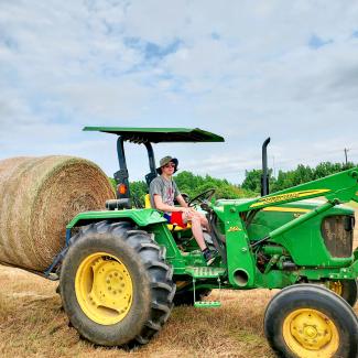 work4college student on tractor