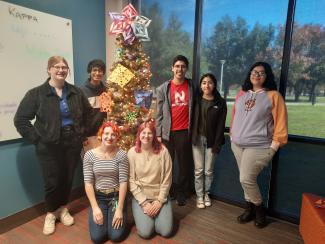 Students with Christmas tree