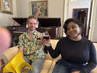 two students drinking out of glasses