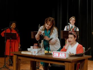 On stage scene with 4 cast members 