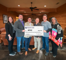 pure hope group presents big check