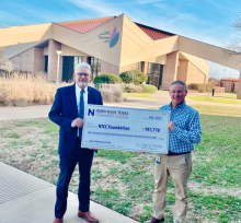 clinton and mccullough with big check