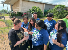 students with baby goat