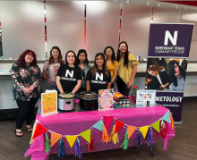 cosmetology club with their booth