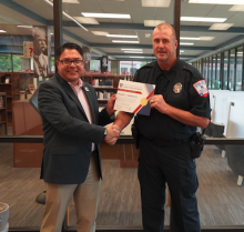 madden receives certificate from rose