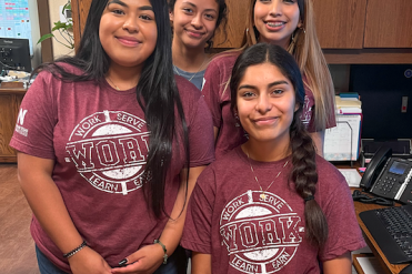 Work4college girls in matching shirts. 