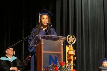 Courtney Baldwin speaking at graduation