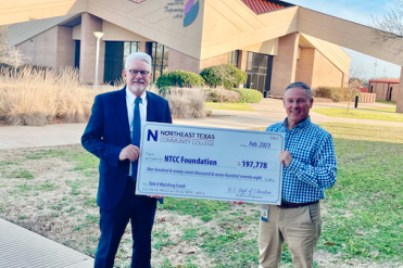 clinton and mccullough with big check