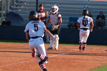 Pictured: Haley McAlexander (5) scoring one of her five runs on the day.
