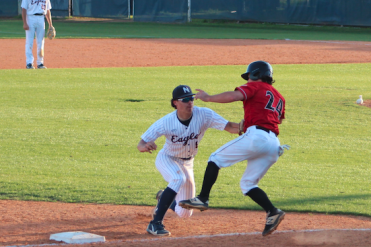 player makes a tag at third for an out