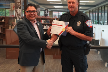 madden receives certificate from rose