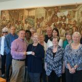 Retired teachers present check