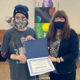 Strong presents Kearney with a certificate