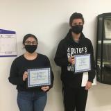 winners posed with certificates
