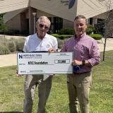 archer presenting big check to Mccullough