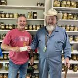Wilson presents scholarship to Mccullough.