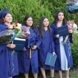 female graduates posing after ceremony