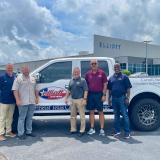 Elliott employees presenting truck