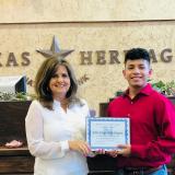 Vice President presents John with award. 