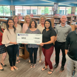 group receiving grant check