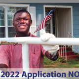 work4college student painting fence
