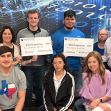 business club presenting checks