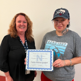 Johnston present Gaspar with award. 