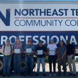 cdl graduates in front of truck