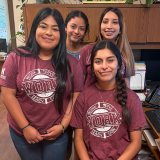 Work4college girls in matching shirts. 