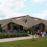people outside after graduation event