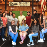 group of students involved in film project posed. 