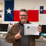 Ian Griffin with award