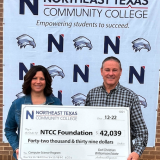 may and McCullough with large check for donation. 