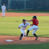 player makes a tag at third for an out