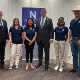 Nathaniel Moran with NTCC students and president